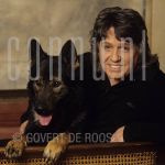 09-05-1988 Arne Jansen at studio in Amterdam.

[keywords]Posed, Half Length, Eyecontact, Smiling, Dog[/keywords]